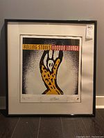 Full front view of framed Rolling Stones Voodoo Lounge lithograph print showing artwork and frame with condition visible.