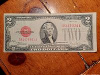 Front side of 1928 United States red seal two-dollar Legal Tender Note showing Thomas Jefferson portrait and red treasury seal