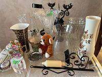Wide view of the lot including vases, teddy bear, candle holders, coasters, hinged box, and desk lamp.