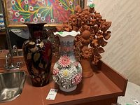 Overview of all three vases displayed side by side