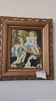 Framed painting of two girls and a dog, detailed view including ornate wooden frame and the $25 price tag.