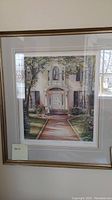 Framed print titled "The Pathway" by Trisha Romance showing a house entry pathway with flowers and greenery in a 24x21 frame.