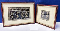Photo showing both framed bronze Egyptian figural wall plaques, the larger 8x11 inches and smaller 7.5x7.5 inches plaques side by side.