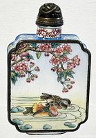 Front view showing detailed painting of pink cherry blossoms and two mandarin ducks on water.