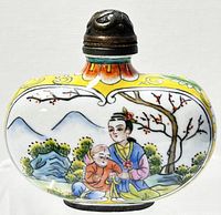 Front view of the Chinese cloisonné enamel perfume bottle showing a woman and child under a tree with a mountain background.