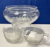 Large crystal glass bowl, glass creamer and sugar bowl with ribbed design and handle on sugar bowl.