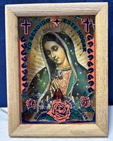 Close-up of the shadowbox framed icon showing the Virgin Mary and decorative roses with visible crack on corner.