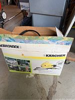 Original Karcher box showing branding and product illustration for Model 210 pressure washer.
