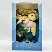 Front view of Muffy the Little MerBear plush doll inside original box with blue underwater-themed packaging.