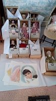 Photo showing 10 collectible dolls in original boxes with certificates.
