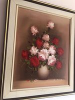 Frontal view of the framed oil painting showing the floral arrangement and artist signature.