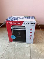 Frigidaire branded ice maker box showing model and capacity information.