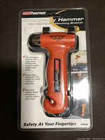 Photo of new Coleman Powermate emergency hammer in original packaging, showing product and features.