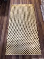 Top view of the yellow foam pad with egg crate pattern