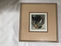 Front view of framed watercolor painting of a cat by Pat Trudeau, dated 1987, showing detailed cat face portrait in a beige mat and light wood frame.