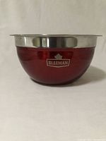 Side view of the bowl showing the red painted exterior with the Sleeman logo and maple leaf.