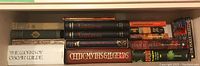 Books on shelf including Citizens folio volumes, Celtic myths, Chinese fairy tales, and works by Oscar Wilde