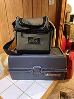 Woodstream plastic tackle box with closed soft fishing bag on top