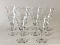 Ten crystal wine glasses, four taller (6.5 inches) and six shorter (5.5 inches) grouped together