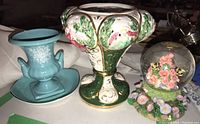 Four items: blue floral vase and plate, ornate Italian potpourri dish, and floral resin music globe
