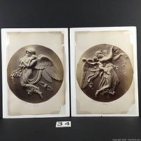 Two early albumen prints mounted on thick cardboard against a black background, showing circular sepia images of classical angelic figures.