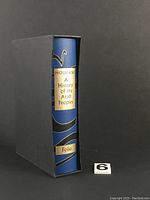 Spine of the blue hardcover book titled 'A History of the Arab Peoples' by Albert Hourani, showing Folio Society label and protective black slipcase.