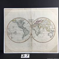 Full view of hand-colored antique world map on paper