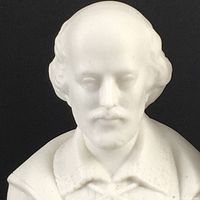 Close-up photo of the white bust sculpture showing detailed facial features and clothing, matte finish.