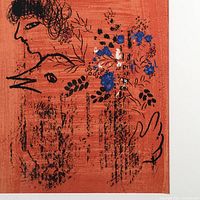 Close-up of black line drawing on red background showing figure profile and floral accents