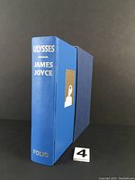 Spine and slipcase of the blue hardcover Ulysses book by James Joyce, showing gilt text and the Folio Society branding.