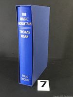 Blue cloth slipcase with silver foil printed title and author on spine: The Magic Mountain Thomas Mann Folio Society