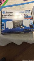 Swann Home Wireless Alarm System box showing model and included components