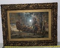 Full view of the ornate gilded wood frame with mat and glass, showing the canoe portage scene.