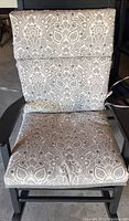 Single outdoor chair showing the patterned floral cushion side installed