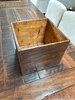 Wooden storage box showing natural brown finish and dovetail corner joinery