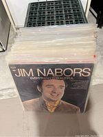 Overall view of vinyl records lot showing Jim Nabors album cover at the front in plastic sleeve