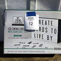 Photo of the new LED cinema lightbox product box showing branding and contents.