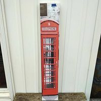 Full view of the new canvas wall art in original packaging depicting a red British telephone booth.