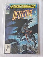 Front cover of Detective Comics #627 showing Batman attacking a masked villain holding a woman, cityscape background at night, celebrating Batman's 600th appearance.