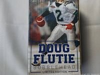 Front of box showing Doug Flutie in Argonauts uniform with football and limited edition text