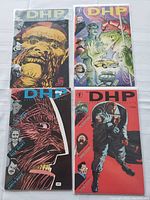 Four Dark Horse Presents comic books displayed, showing distinct colorful covers including an ape, alien, human portraits, and astronauts.