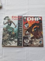 Two Dark Horse Presents Fifth Anniversary Special comic issues laid flat showing front covers
