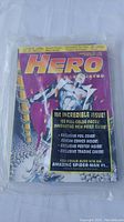 Photo of HERO comic first issue 1993 with foil cover showing vibrant front cover with superhero character and text.