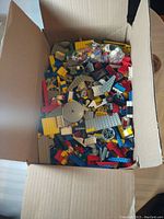 Box of assorted LEGO bricks and elements