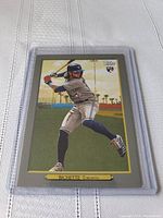 Front of Bo Bichette rookie card in protective sleeve showing player batting with Toronto Blue Jays uniform and Topps branding