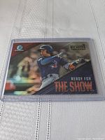 Front of Bo Bichette rookie card in protective sleeve showing player batting photo and text 'Ready for the Show'