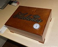 Top view of the wooden humidor box with Habanos logo and hygrometer.