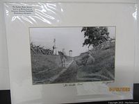 Antique black and white photo of The Sunken Road with soldiers and battlefield monuments visible, matted and protected.