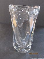 Front view of clear crystal vase showing geometric contours and thickness.