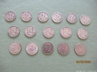 Overview of sixteen half-dollar coins showing obverse and reverse of various designs and dates from 1940 to 2000